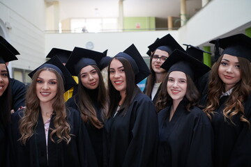 Group of diverse international graduating students celebrating