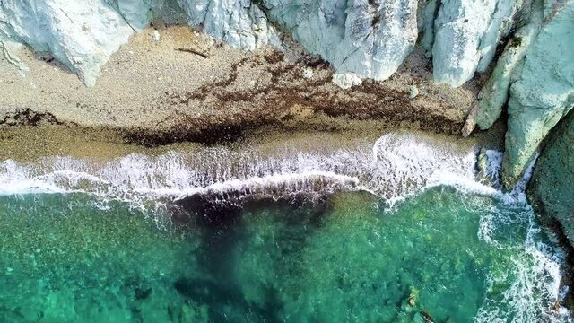 Foca izmir drone aerical wiev sea beautiful holiday trip. Drone view of beautiful seamless never ending footage while turquiose sea waves breaking on sandy coastline. Aerial shot of golden beach.