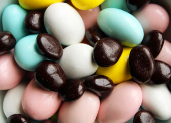 Mix of  chocolate and almond candies, top view,sweets background
