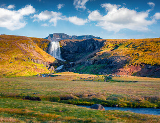 Beautiful autumn scenery. Wonderful morning scene of Svodufoss watterfall. Majestic autumn view of Iceland, Europe. Beauty of nature concept background.