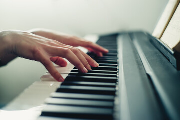 hands on the piano close-up