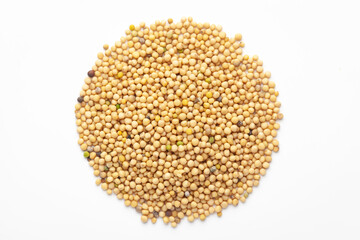 Macro close-up of Organic Mustard seed (Sinapis alba) on white background. Pile of Indian Aromatic Spice. Top view