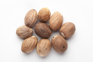 Macro close-up of Organic mace with nutmeg seed   (Myristica fragrans) on white background. Pile of...