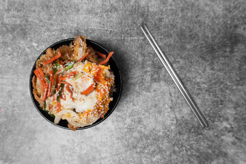 Topview Japanese food, Katsu Don is breaded deep-fried pork and eggs cooked in a sweet and salty served on rice.