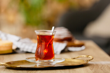 Cup of hot tea on table