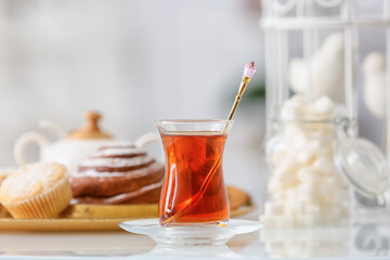 Cup of hot tea on table