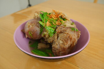 A bowl of beef bone marrow soup