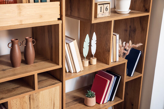 Modern shelf units with books and decor, closeup