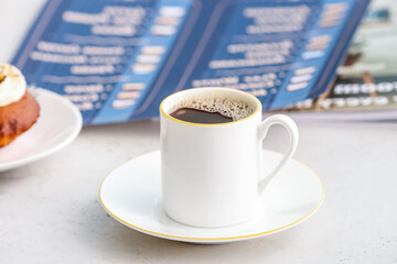 Cup of coffee on table in cafe