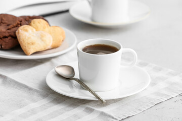 Cup of coffee on table in cafe
