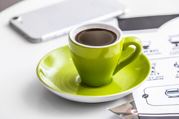 Cup of coffee on table in cafe