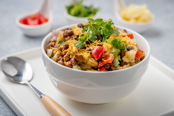 black gram or kala chana chaat with boiled potato, onion, tomato with a dash of lemon juice served...