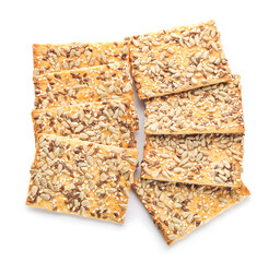 Tasty crackers with seeds on white background