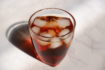 glass of iced tea in white background