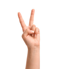 Female hand showing victory gesture on white background