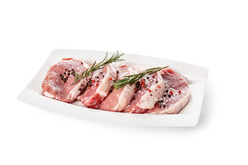 Plate with fresh raw meat and spices on white background