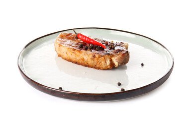Plate with tasty steak and spices on white background