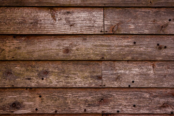 Obraz premium Background image of brown wood grain with scratches