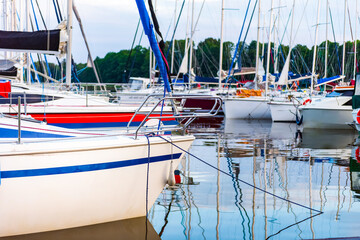 moored sailboats on a pier calm early morning