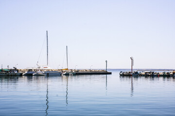 Fototapeta na wymiar Ships on the seascape horizon, natural blue background, pure sky