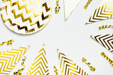 Festive white and gold paper fans, gold confetti for party, birthday, holiday, wedding on light...