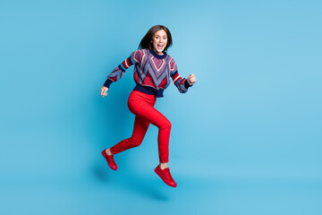 Fototapeta na wymiar Full length body size view of attractive thin cheerful girl jumping running motion isolated over bright blue color background