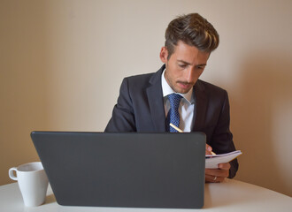 businessman in suit working at computer.