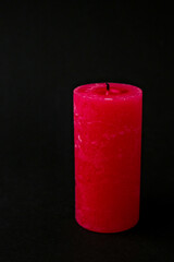 Red candle extinguished on black background. Copy space for text. Romantic.