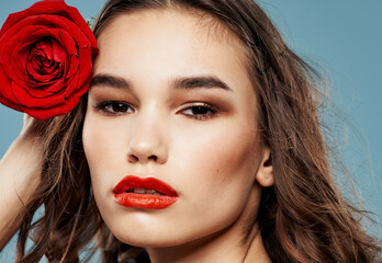 Fototapeta na wymiar Close-up woman portrait red rose cropped view of brunette