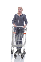 in full growth. smiling woman in casual clothes with shopping cart