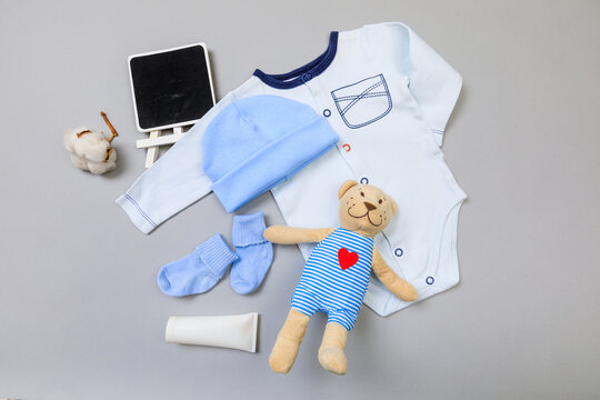 Baby concept. Baby cloth and goods on grey  background. Place for text. View from above. Flat Lay - Image