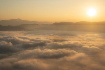 A sea of mist at the sunrise at the Iyaweng Betong Skywalk shining golden light.