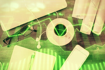 Multi exposure of forex graph drawing over desktop background with computer. Concept of financial...