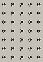 A pattern with mugs filled with black coffee on a gray background. Top view