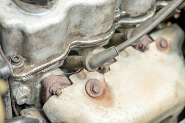 Under the hood of the car are the connected armored wires of the gasoline engine spark plug.