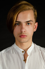 Obraz premium Portrait of a young attractive guy with blue eyes.