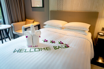 Happy Elephant towel art Welcome Hotel Bed.