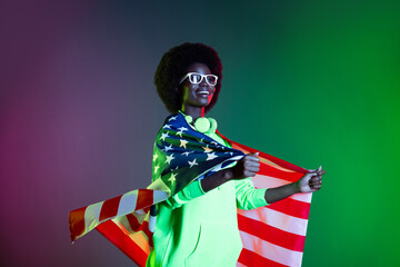 Photo of disco 80s lady wrapped american flag wear earphones specs sweatshirt isolated gradient green neon background