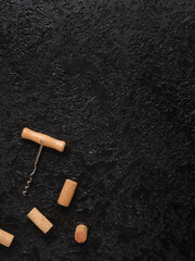 Top view of wine bottle corks and corkscrew with wooden handle