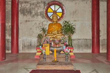 Phayao, Thailand - Dec 20, 2020: Gold Chinese Buddha Statue Sit on Concrete Base in Chinese Temple at Wat Analayo Temple