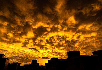 dramatic yellow clouds over the building.