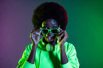 Photo of crazy 90s style lady take off sunglass open mouth wear sweatshirt isolated gradient green...