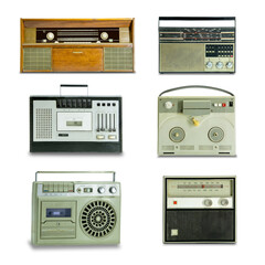 A few old radios on a white background.