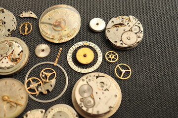 Clockwork gear wheels, close up view. Industry background. A few old watches