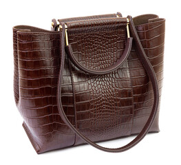 Dark brown reptile leather women's handbag isolated on white background, closeup. Fashion and...