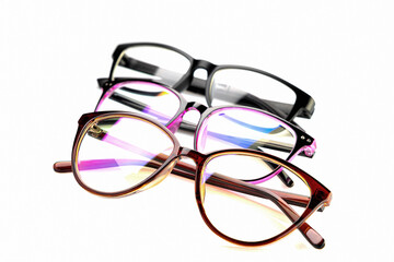 Glasses of different colors, in a plastic frame, with transparent optics, on a white background