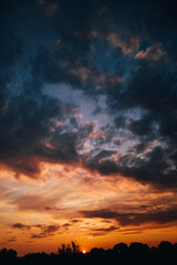 beautiful bright sunset, expressive blue-orange sky. Evening time