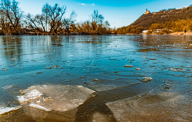 Beautiful winter landscape with details of ice sheets in the water at the famous Bogenberg, Danube, Bavaria, Germany