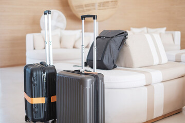 Two Black Luggage bag or Suitcase in modern hotel during check in. Time to travel, service, journey, trip, summer holiday and vacation concepts