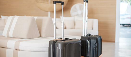 Two Black Luggage bag or Suitcase in modern hotel during check in. Time to travel, service, journey, trip, summer holiday and vacation concepts